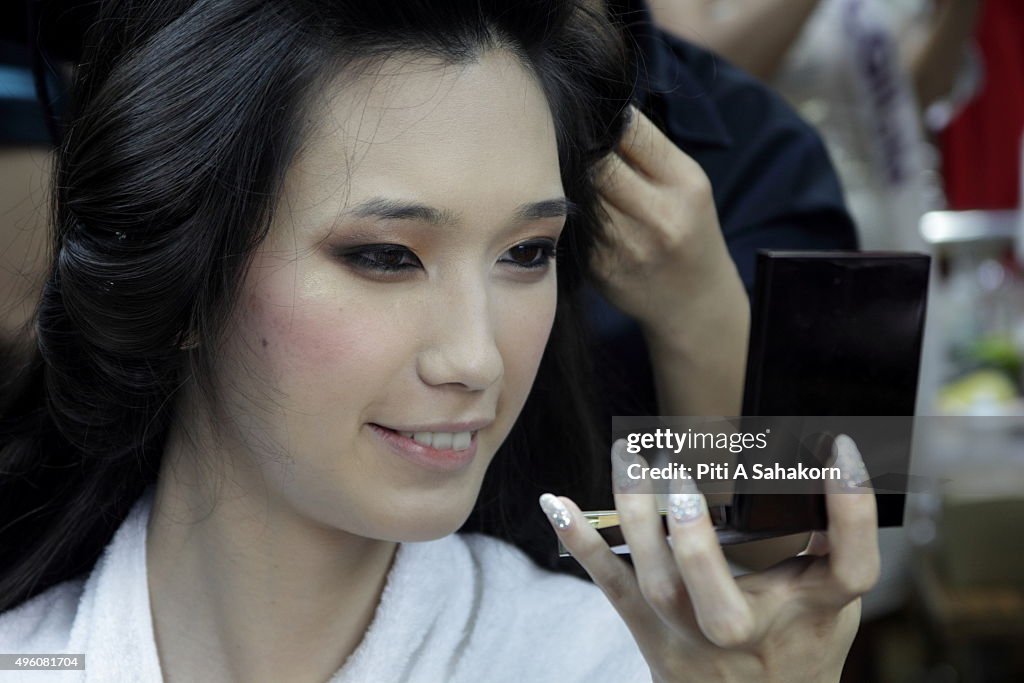Contestant Sutsuki from Japan prepares backstage before the...