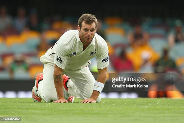 Doug Bracewell of New Zealand looks up after falling while bowling during day three of the First Test match between Australia and New Zealand at The...