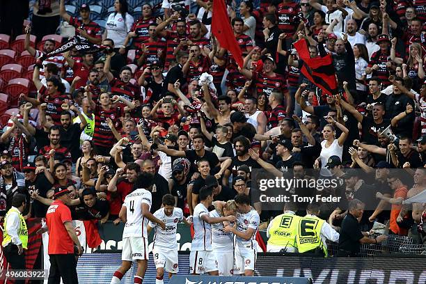 Wanderers players celebrate after scoring the winning goal during the round five A-League match between the Newcastle Jets and the Western Sydney...