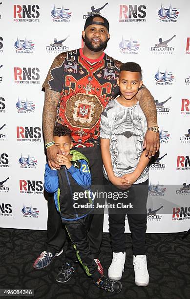 Yankees Pitcher C.C. Sabathia poses with his sons Carter and Lil C at their PitCCh In Foundation's 5th Annual CC Challenge rules party at Bowlmor...