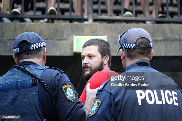 Wanderers fan is escorted from the ground during the round five A-League match between the Newcastle Jets and the Western Sydney Wanderers at Hunter...