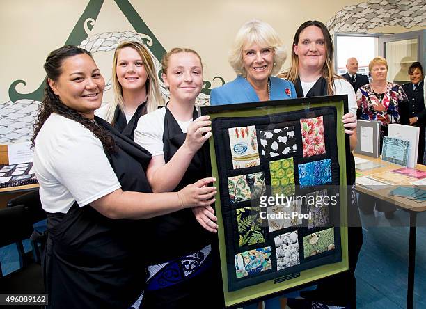 Camilla, Duchess of Cornwall is presented with a quilt by inmates at Arohata Women's Prison on November 7, 2015 in Tawa, Wellington, New Zealand. The...