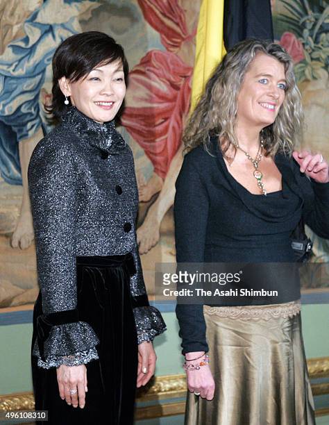 Akie Abe, wife of Japanese Prime Minister Shinzo Abe and Dominique Verkinderen, wife of Belgium Prime Minister Guy Verhofstadt are seen during their...