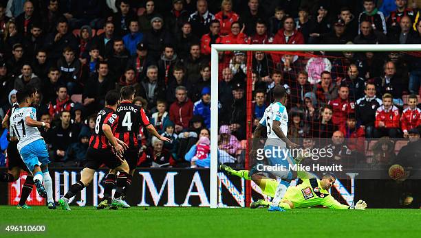 Ayoze Perez of Newcastle United scores his team's first goal past Adam Federici of Bournemouth during the Barclays Premier League match between...