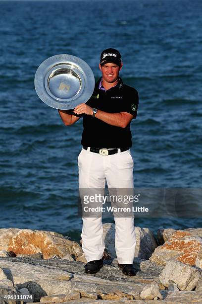 Ricardo Gouveia of Portugal poses with the Road to Oman Rankings trophy after winning the NBO Golf Classic Grand Final at the Almouj Golf Club, The...