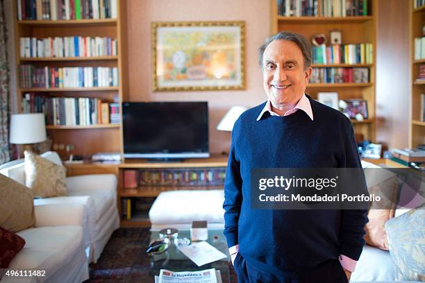 The journalist Emilio Fede posing smiling in in his house in Milano 2. Segrate, Italy. 9th May 2014