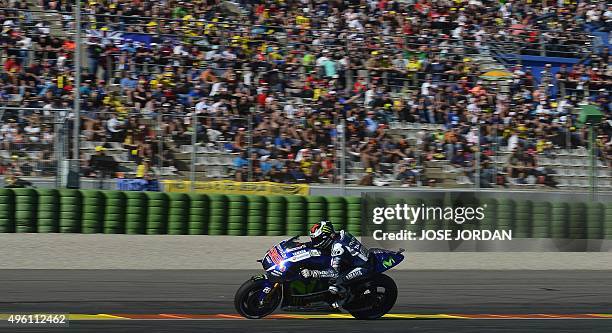 Movistar Yamaha MotoGP's Spanish rider Jorge Lorenzo rides during the MotoGP qualifying session on the eve of the Valencia Grand Prix at Ricardo...