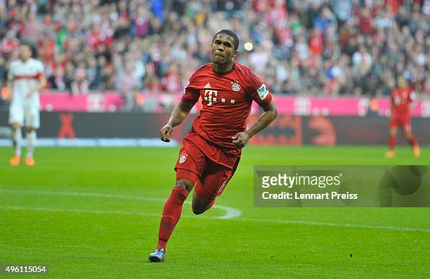 Douglas Costa celebrates his side's second goal during the Bundesliga match between FC Bayern Muenchen and VfB Stuttgart at Allianz Arena on November...