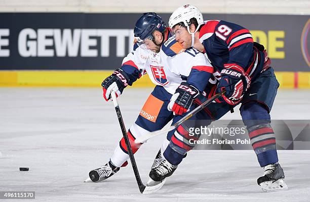 Eduard Sedivy of Team Slovakia and Jim Slater of Team USA during the game between USA and the Slovakia on November 6, 2015 in Augsburg, Germany.