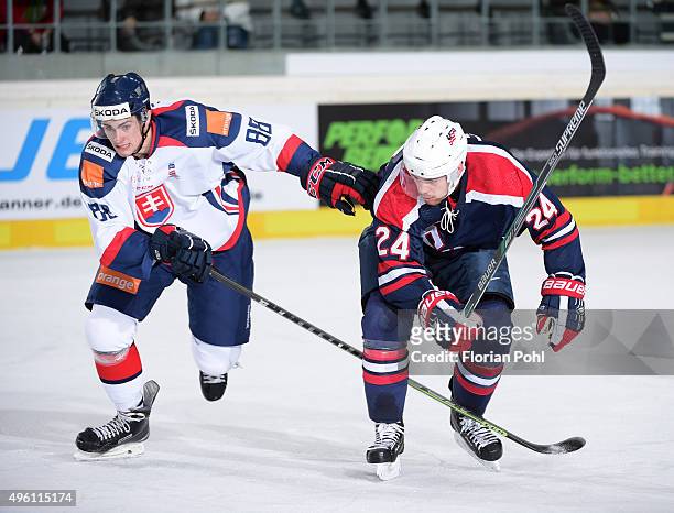Michal Hlinka of Team Slovakia and Drew LeBlanc of Team USA during the game between USA and the Slovakia on November 6, 2015 in Augsburg, Germany.