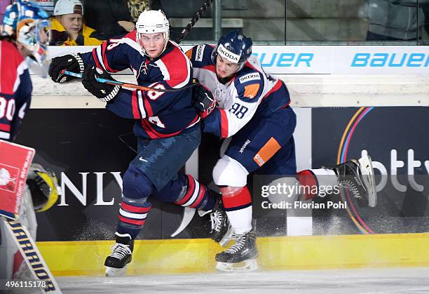 Cade Fairchild of Team USA and Michal Hlinka of Team Slovakia during the game between USA and the Slovakia on November 6, 2015 in Augsburg, Germany.