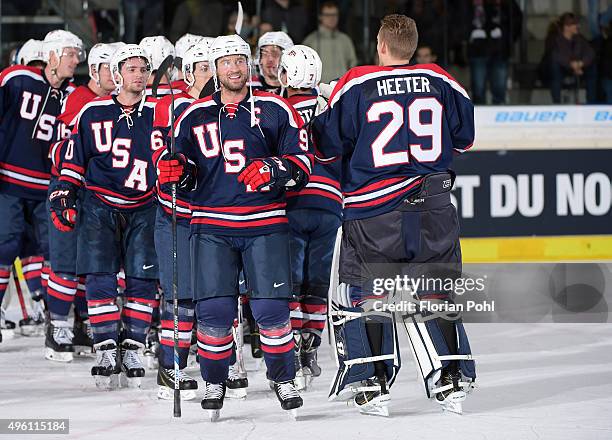 Adam Burish and Calvin Heeter of Team USA during the game between USA and the Slovakia on November 6, 2015 in Augsburg, Germany.