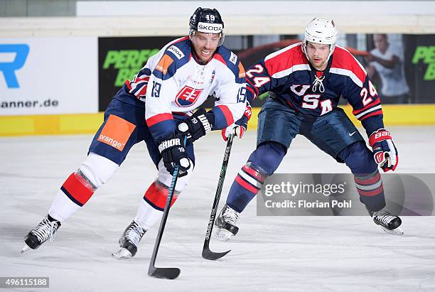 Michel Miklik of Team Slovakia and Drew LeBlanc of Team USA during the game between USA and the Slovakia on November 6, 2015 in Augsburg, Germany.