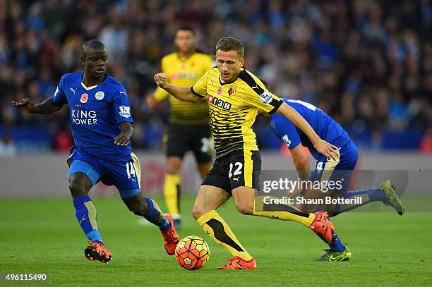 Almen Abdi of Watford and Ngolo Kante of Leicester City compete for the ball during the Barclays Premier League match between Leicester City and...