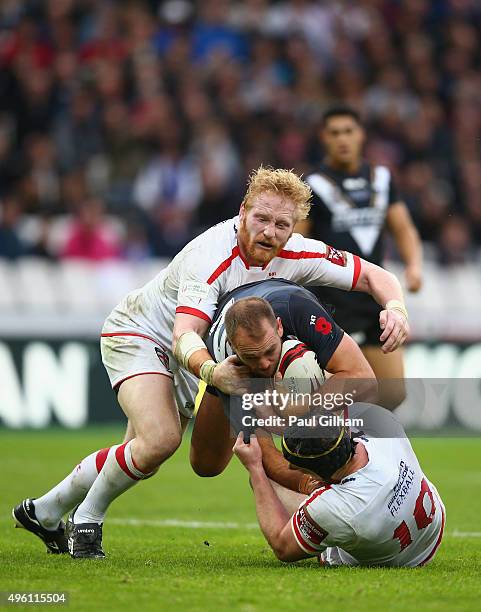 Jason Nightingale of New Zealand is tackled by James Graham and Chris Hill of England during the International Rugby League Test Series match between...