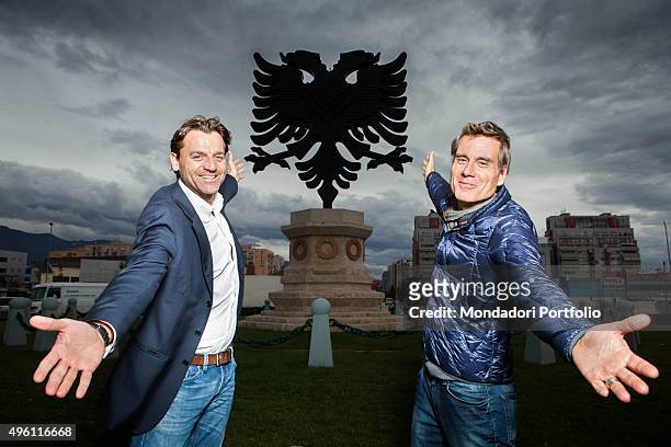 The journalist and presenter Alessio Vinci and the TV personality Jimmy Ghione posing in front a double-headed eagle monument. They are some of the...
