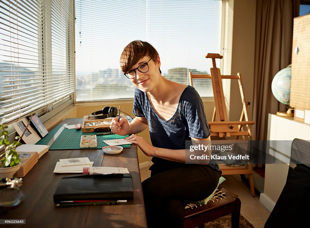 Portrait of female artist working at studio