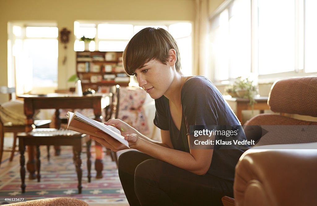 Reading book at home