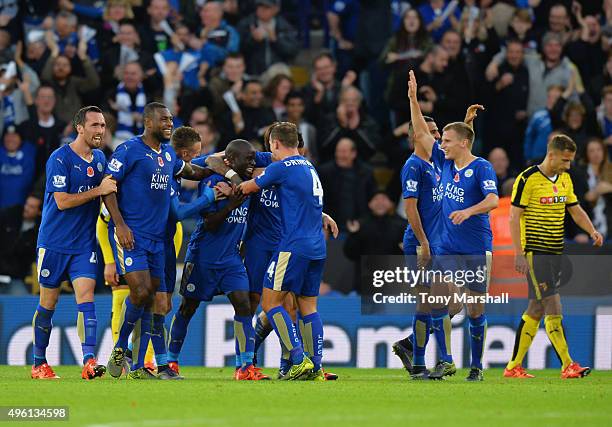 Ngolo Kante of Leicester City celebrates scoring his team's first goal with his team mates during the Barclays Premier League match between Leicester...