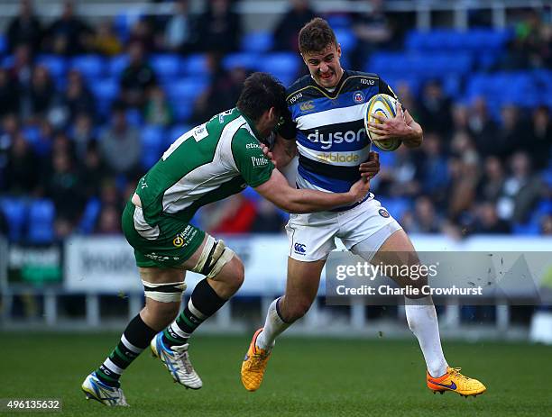 Bath's Ollie Devoto tries to hold off the tackle from London Irish's David Sisi during the Aviva Premiership match between London Irish and Bath...