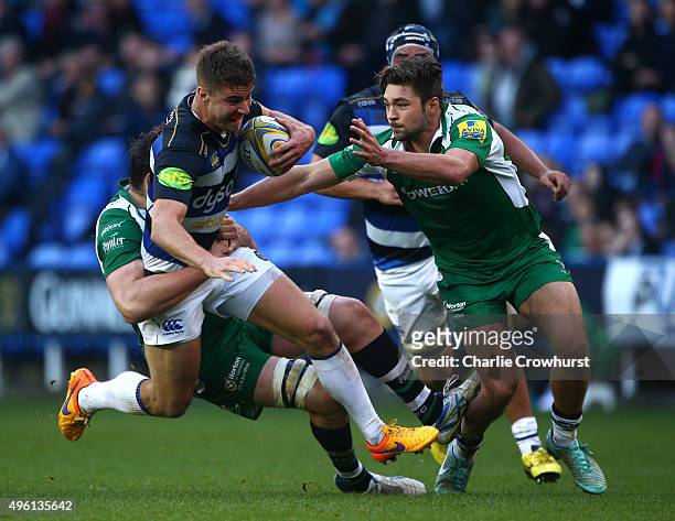 Bath's Ollie Devoto tries to hold off the tackle from London Irish's David Sisi during the Aviva Premiership match between London Irish and Bath...