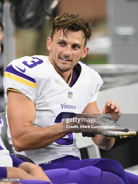 Blair Walsh of the Minnesota Vikings looks on from the sidelines while holding his shoe during the game against the Detroit Lions at Ford Field on...