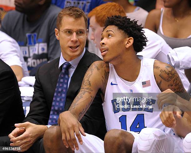 Assistant Coach Jon Scheyer shares a laugh with Brandon Ingram of the Duke Blue Devils during their game against the Livingstone Blue Bears at...