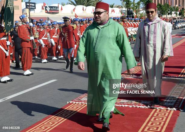 Morocco's King Mohammed VI and his brother Prince Moulay Rachid arrive at a ceremony to sign conventions for projects in the region of the Western...