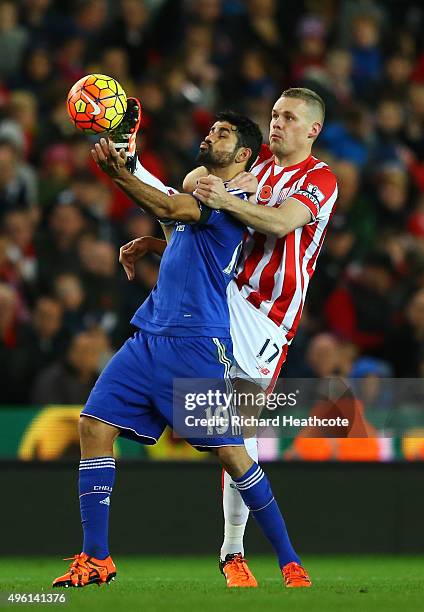 Diego Costa of Chelsea and Ryan Shawcross of Stoke City compete for the ball during the Barclays Premier League match between Stoke City and Chelsea...