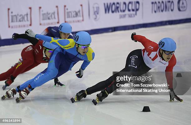Alexander Fathoullin of Canada competes against Denis Nikisha of Kazakhstan on Day 1 of the ISU World Cup Short Track Speed Skating competition at...
