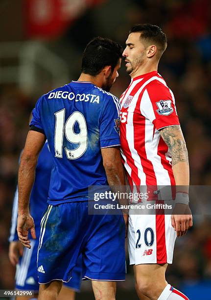 Diego Costa of Chelsea and Geoff Cameron of Stoke City argue during the Barclays Premier League match between Stoke City and Chelsea at Britannia...