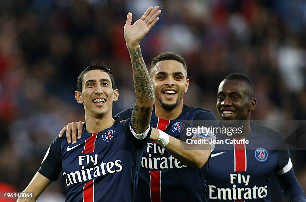 Angel Di Maria of PSG celebrates scoring the first goal with Layvin Kurzawa and Blaise Matuidi of PSG during the French Ligue 1 match between Paris...