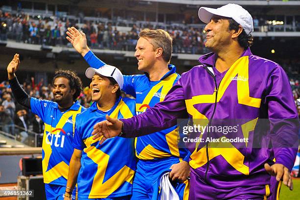 Sachin's Blasters player Sachin Tendulkar waves to the crowd with other players after a match in the Cricket All-Stars Series at Citi Field on...