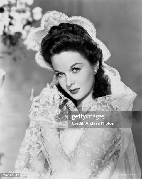 Posed studio portrait of actress Susan Hayward wearing white lace, to promote the movie 'I Married a Witch' for Paramount Pictures, 1942.