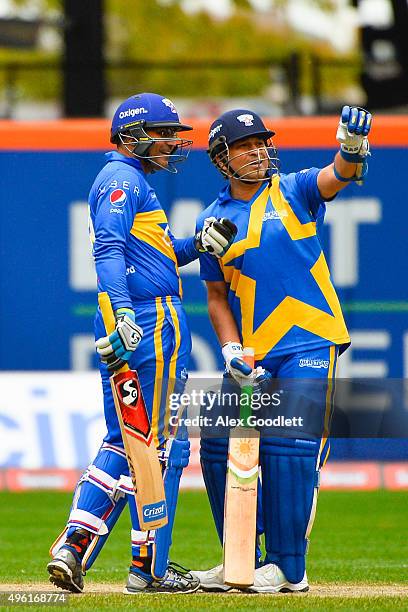 Sachin's Blasters player Sachin Tendulkar speaks to teammate Virender Sehwag during a match in the Cricket All-Stars Series at Citi Field on November...