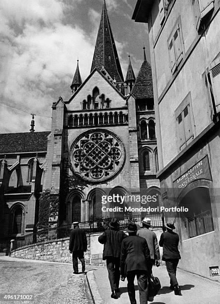 Men going towards the Cathedral of Notre Dame. Lausanne, 1950s