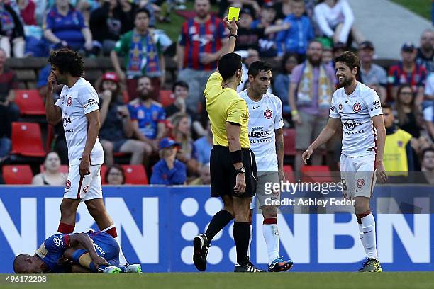 Andreu of the Wanderers recieves a yellow card over an incident with Leonardo Santiago of the Jets laying on the ground during the round five...