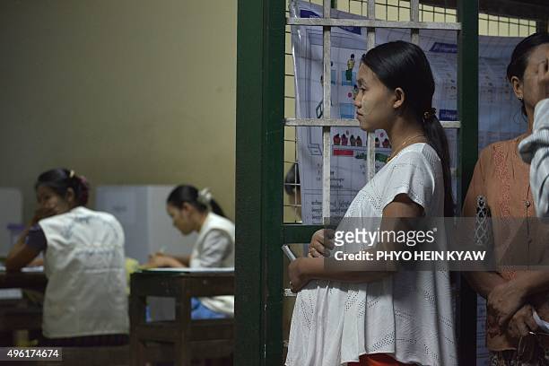 Myanmar voter Chan Myae Thu a nine months old pregnant woman queues at a polling centre in Hlaing Thayar, Yangon on November 8, 2015. Myanmar goes to...
