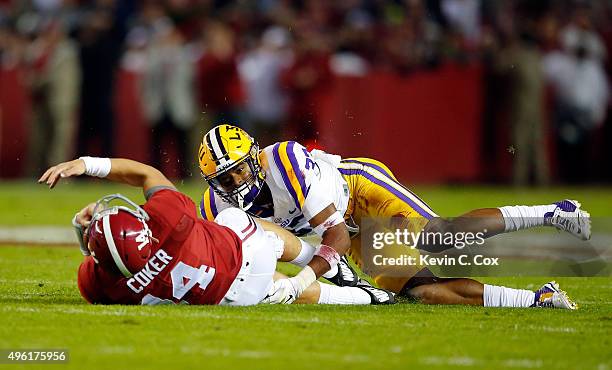 Jamal Adams of the LSU Tigers stops quarterback Jake Coker of the Alabama Crimson Tide from getting a first down in the first quarter at Bryant-Denny...