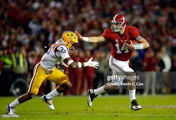 Jamal Adams of the LSU Tigers stops quarterback Jake Coker of the Alabama Crimson Tide from getting a first down in the first quarter at Bryant-Denny...