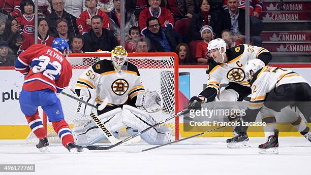 Brian Flynn of the Montreal Canadiens takes a shot on goal Jonas Gustavsson the Boston Bruins in the NHL game at the Bell Centre on November 7, 2015...