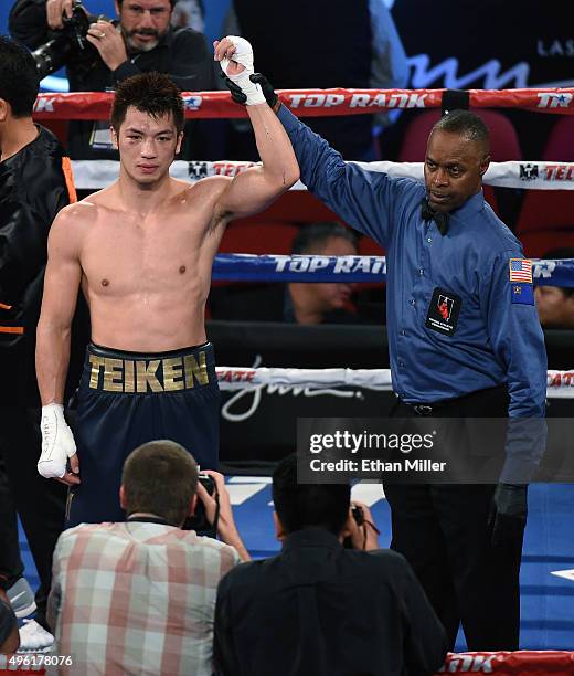 Referee Kenny Bayless holds up Ryota Murata's arm after his unanimous-decision victory over Gunnar Jackson in their middleweight fight at the Thomas...