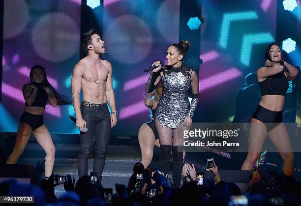 Singer Prince Royce and Jennifer Lopez perform onstage at iHeartRadio Fiesta Latina presented by Sprint at American Airlines Arena on November 7,...