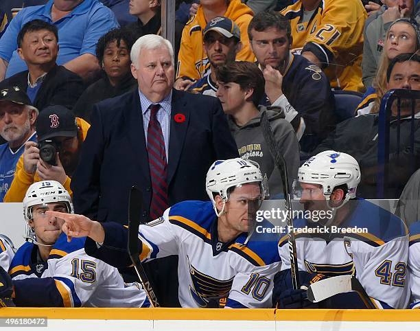 Head coach Ken Hitchcock watches from the bench during a game against of the Nashville Predators in the second period at Bridgestone Arena on...