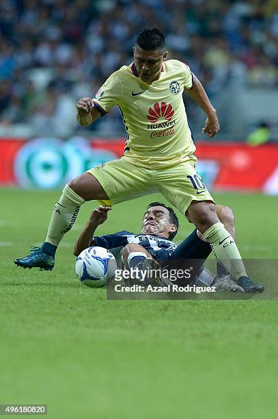 Luis Perez of Monterrey fight for the ball with Osvaldo Martinez of America during the 16th round match between Monterrey and America as part of the...