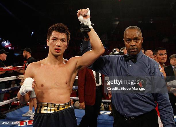 Ryota Murata has his arm raised by referee Kenny Bayless after beating Gunnar Jackson by unanimous decision in a middleweight fight at the Thomas &...