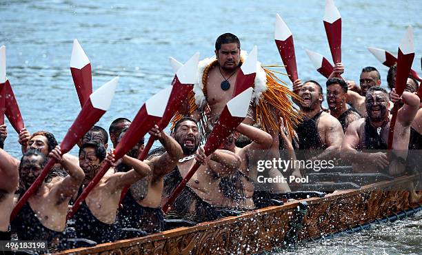 Five waka, maori canoes on the Waikato River salute Prince Charles, Prince of Wales and Camilla, Duchess of Cornwall at Turangawaewae Marae on...