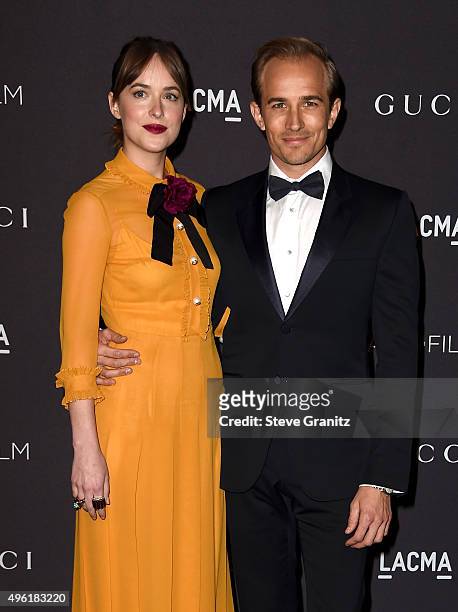 Actress Dakota Johnson, wearing Gucci, and actor Jesse Johnson attend LACMA 2015 Art+Film Gala Honoring James Turrell and Alejandro G Iñárritu,...