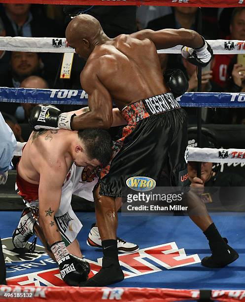 Brandon Rios falls to the canvas after being knocked down by Timothy Bradley Jr. In the ninth round of their WBO welterweight title fight at the...
