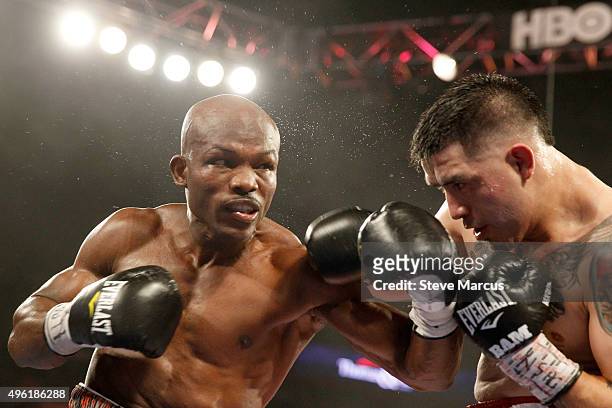 Welterweight champion Timothy Bradley Jr. Punches Brandon Rios during their title fight at the Thomas & Mack Center on November 7, 2015 in Las Vegas,...